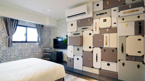 a bedroom with a stack of boxes in a room at K Hotel - Yizhong in Taichung
