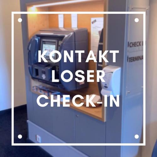 a kronitz laser check in sign with a cash register at MLOFT Apartments München in Munich