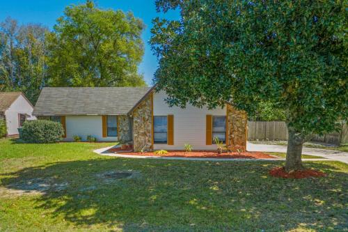 a house with a tree in front of it at Blue Heron in Jacksonville