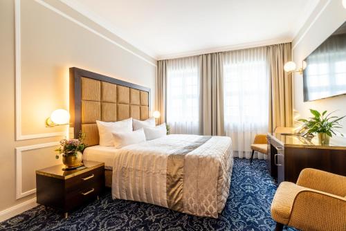 Postel nebo postele na pokoji v ubytování Hotel Suitess