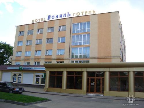 a hotel building with a sign on top of it at Hotel LUDMIR in Volodymyr-Volynsʼkyy