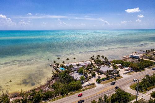 an aerial view of the beach and the ocean at Rainbow Bend Resort in Marathon