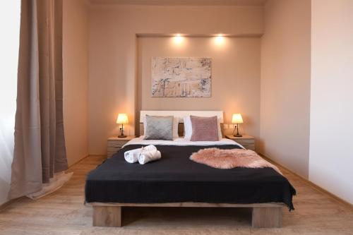 Ένα ή περισσότερα κρεβάτια σε δωμάτιο στο PASTEL HUES - Homey Central Apartment near Armeneasca
