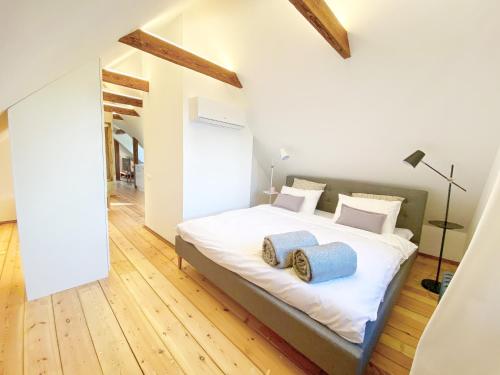 a bedroom with a bed with two pillows on it at Villa Gaida in Saulkrasti