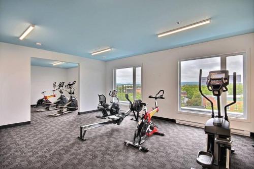 a gym with several exercise bikes in a room at The Shack by BnbCopilote in Quebec City