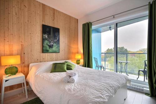 a bedroom with a bed with two stuffed animals on it at The Shack by BnbCopilote in Quebec City