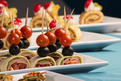 a bunch of appetizers on plates on a table at Lancaster House in Bogotá