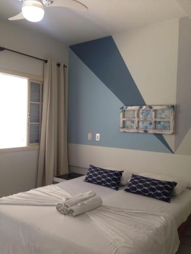 Una cama o camas en una habitación de Pousada Mar E Mata