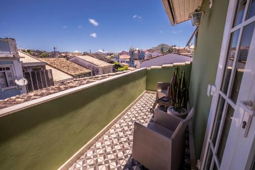 a balcony with a view of a city at Pousada Bahia Pelô in Salvador