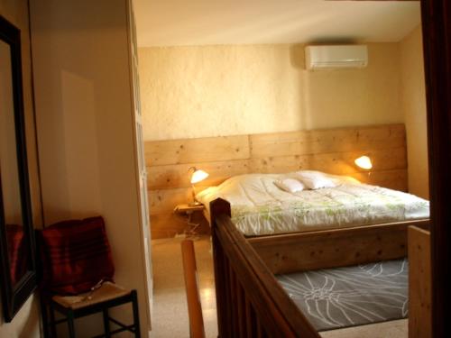 Postel nebo postele na pokoji v ubytování Le Mazet