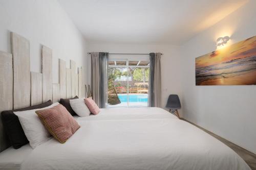 A bed or beds in a room at Villa Clara Ibiza