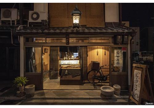 a building with a light on top of it at ORIENTAL HOTEL KYOTO ROKUJO in Kyoto