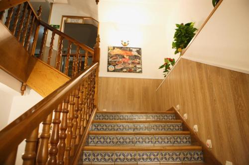a staircase leading up to a stair case at Hotel plaza in Riaza