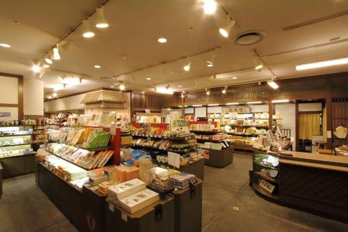 a store filled with lots of items on display at Dogo Kan in Matsuyama