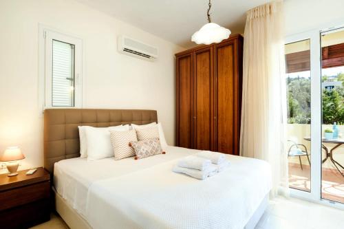Postel nebo postele na pokoji v ubytování Seven Springs Villas