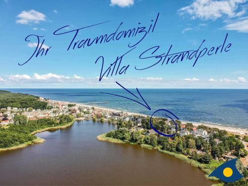 widok z powietrza na rzekę ze słowami transplantingititisitis white w obiekcie Villa Strandperle Whg 05 w mieście Bansin