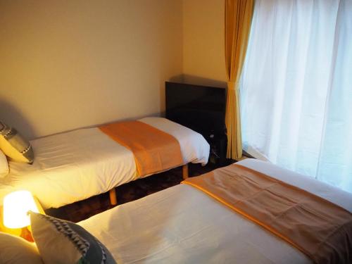 Cama o camas de una habitación en KYOTO SHIMA