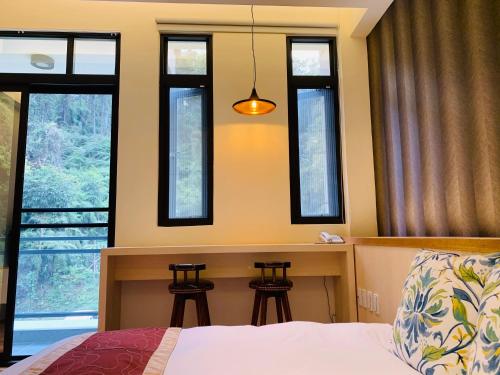 Katil atau katil-katil dalam bilik di 日月潭沅居民宿 YUAN JU BOUTIQUE Hotel