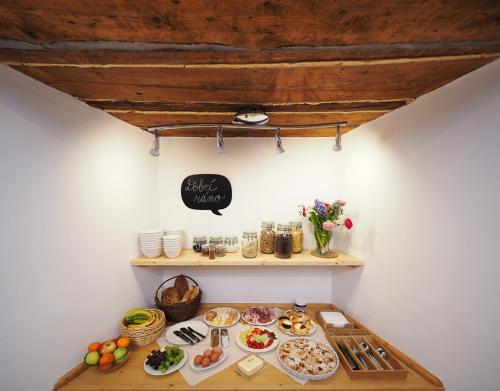 a table with food on it in a room at Penzion Kamenne Slunce in Telč