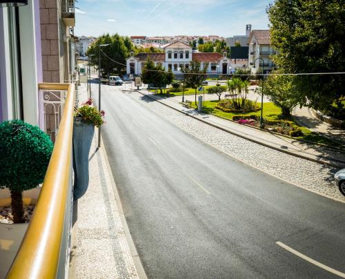 a view of a street from a balcony at Hotel Muchacho in Macedo de Cavaleiros
