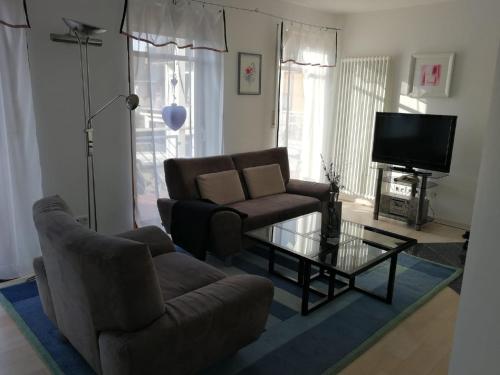 a living room with a couch and a coffee table at Haus Leifert in Bad Sassendorf