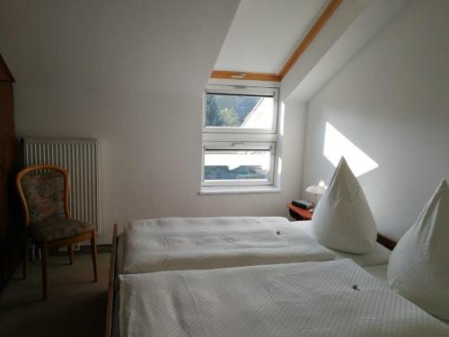 Кровать или кровати в номере Haus Leifert