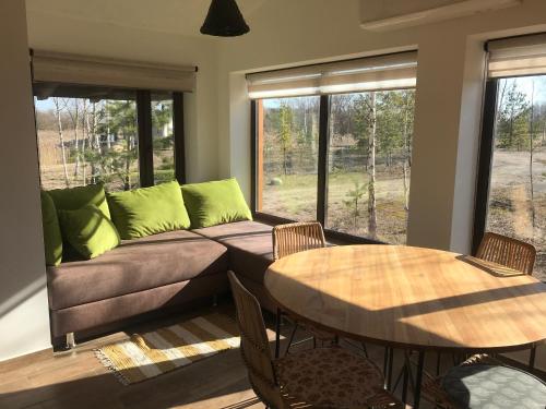 a living room with a couch and a table at SKY Ranch in Izborsk