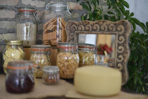 a table with jars of oats and a mirror at Capannone111 in Castiglione di Ravenna