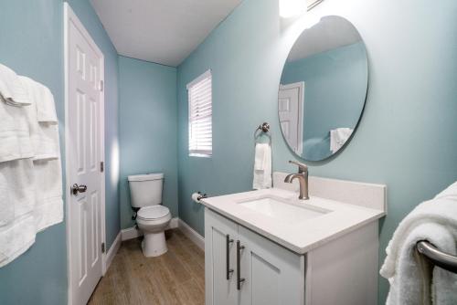 a bathroom with a sink and a mirror at Rainbow Bend Resort in Marathon