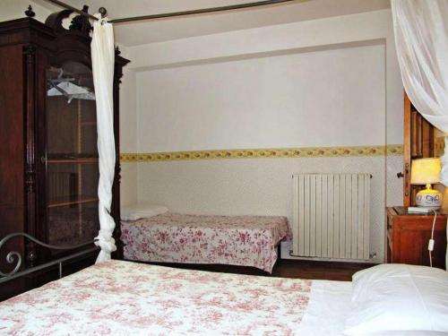 Postel nebo postele na pokoji v ubytování Podere Caldaruccio La Pineta Chalet