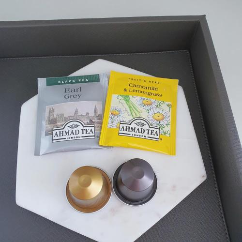 a box with two books and two candles in it at 쏘타스위트 속초 월드스테이트 in Sokcho