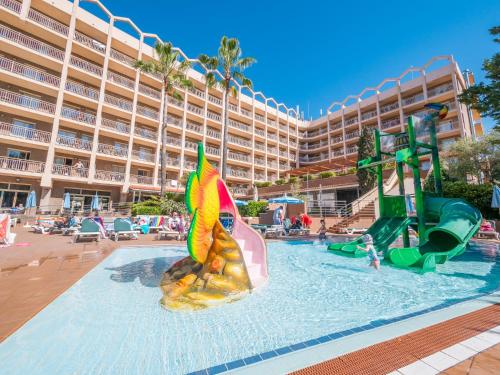 a pool at a hotel with a water slide at Golden Avenida Family Suites 4* in Salou