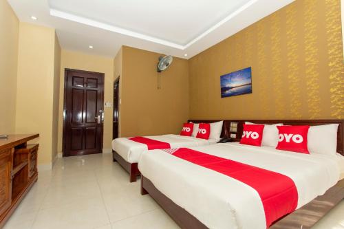 מיטה או מיטות בחדר ב-Phuc Long Hotel