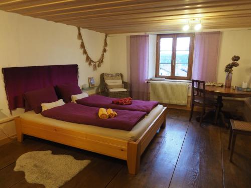 a bedroom with a bed with two teddy bears on it at BnB Lafleur in Montfaucon