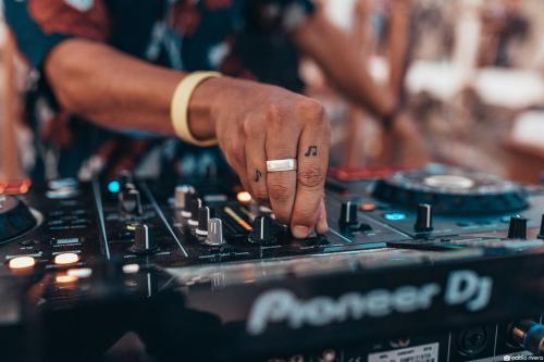 a person with a ring on their finger playing a mixing board at ON Hotels Oceanfront Adults Designed in Matalascañas