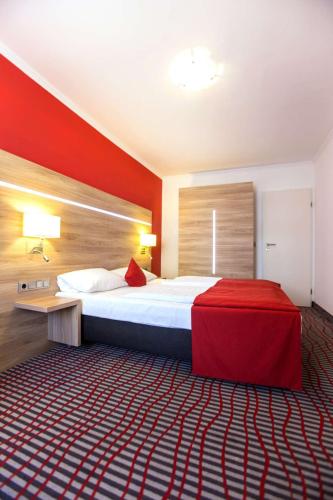 Ένα ή περισσότερα κρεβάτια σε δωμάτιο στο NP Hotel Wallis