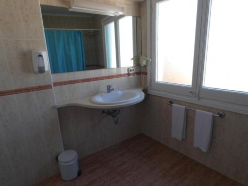 a bathroom with a sink, toilet and tub at Utopia Beach House in Sitges