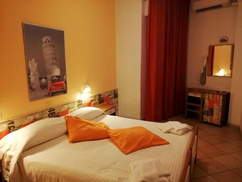 מיטה או מיטות בחדר ב-Hotel Galles Rimini