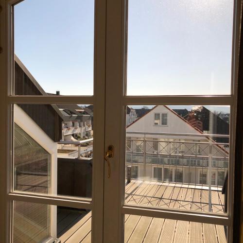 an open window with a view of a building at Hotel Scherf in Bad Lippspringe
