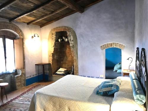 Postel nebo postele na pokoji v ubytování La Locanda del Loggiato