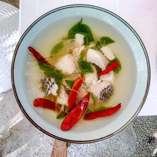 a bowl of soup with peppers and vegetables in it at Bliss Dhigurah in Dhigurah