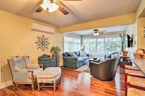 a living room with a couch and a table at Downtown Charlevoix Duplex half Mi to Lake Michigan in Charlevoix