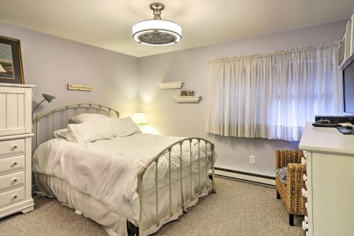 a bedroom with a bed and a window at The Shores Condo with Beach Access Less Than 2 Mi to Dtwn! in Port Clinton