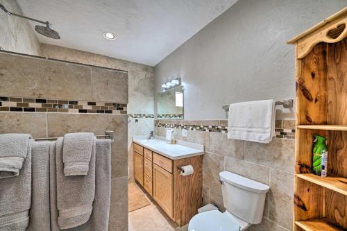 a bathroom with a toilet and a sink at Well-equipped Cody Cottage 2 Miles to Cody Rodeo! in Cody