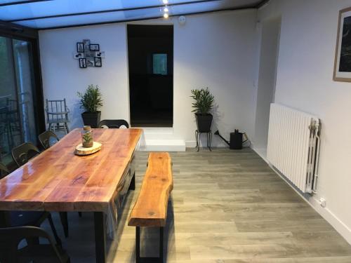 a large room with a wooden table and chairs at Ardeche2coeur in Marcols-les-Eaux