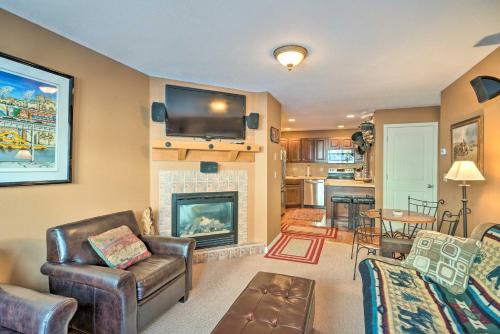 a living room with a fireplace and a tv at Charming Big Sky Ski Nook Less Than 1 Mile to Ski Resort! in Big Sky