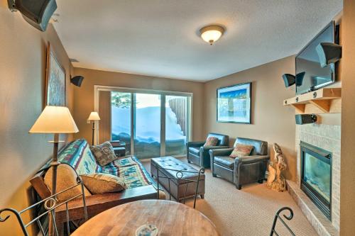a living room with a couch and a fireplace at Charming Big Sky Ski Nook Less Than 1 Mile to Ski Resort! in Big Sky