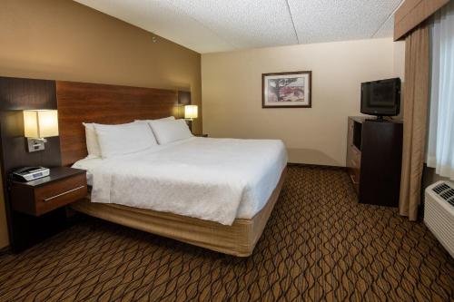 a hotel room with a bed and a television at Grand Canyon Hotel & Suites in Tusayan