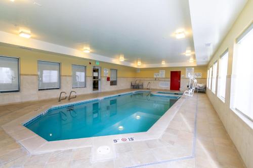 a large swimming pool in the middle of a building at Holiday Inn Express Hotel & Suites Limon I-70/Exit 359 by IHG in Limon