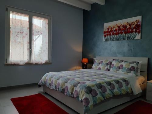 a bedroom with a bed and a window at Villa Marianna Garda Lake in Peschiera del Garda